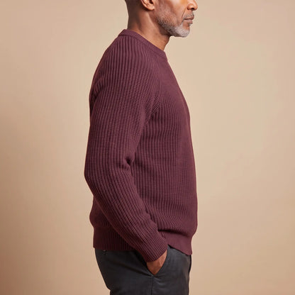 Side view of a red chunky rib crew sweater for men, showing the raglan sleeve and ribbed knit