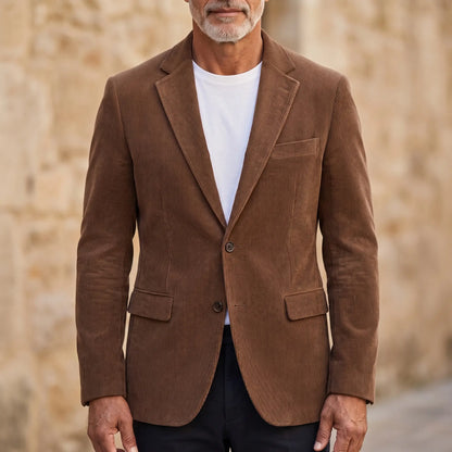 Man wearing brown classic corduroy blazer buttoned over a white tee