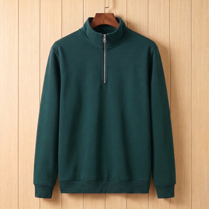 Men's dark green half-zip stand collar sweatshirt on a wooden hanger
