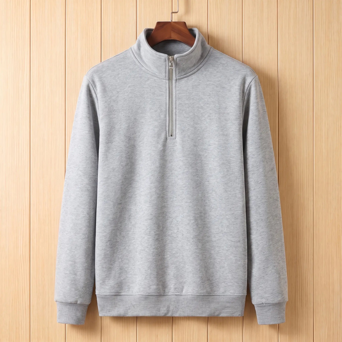 Men's light grey half-zip stand collar sweatshirt on a wooden hanger