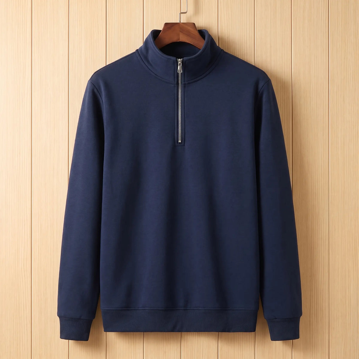 Men's navy blue half-zip stand collar sweatshirt on a wooden hanger