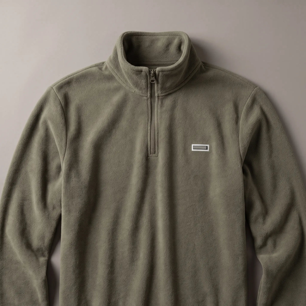 Flat lay of CLEAN FRONT FLEECE showing the tall stand collar and quarter zip