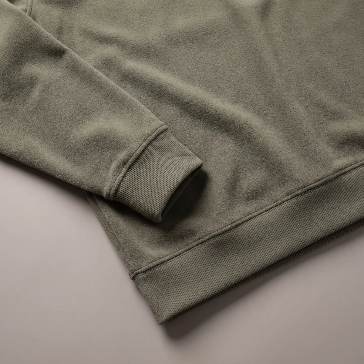 Close detail of CLEAN FRONT FLEECE showing the ribbed cuff and hem