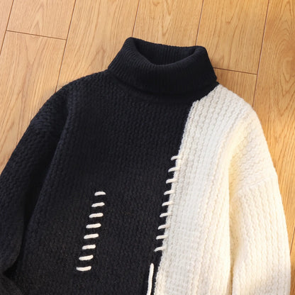 Close-up of the roll neck and colour split on the black turtleneck