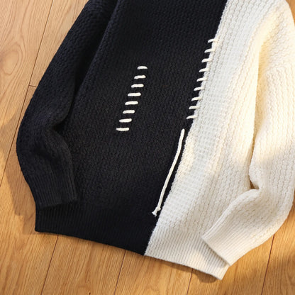 Close-up of the white cord stitching and hem on the black turtleneck