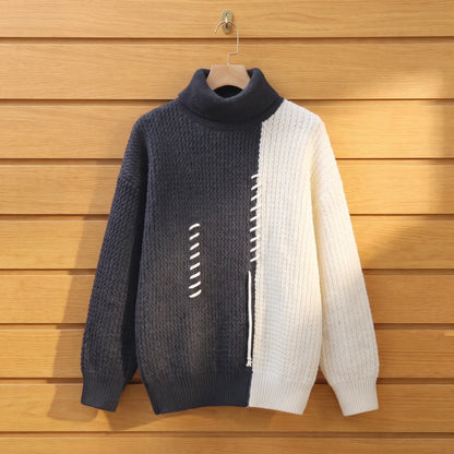 Men's grey and cream colour block knit turtleneck on a wooden hanger