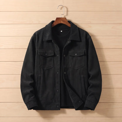 Corduroy chore jacket in black on a hanger