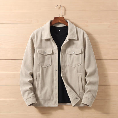 Corduroy chore jacket in cream on a hanger