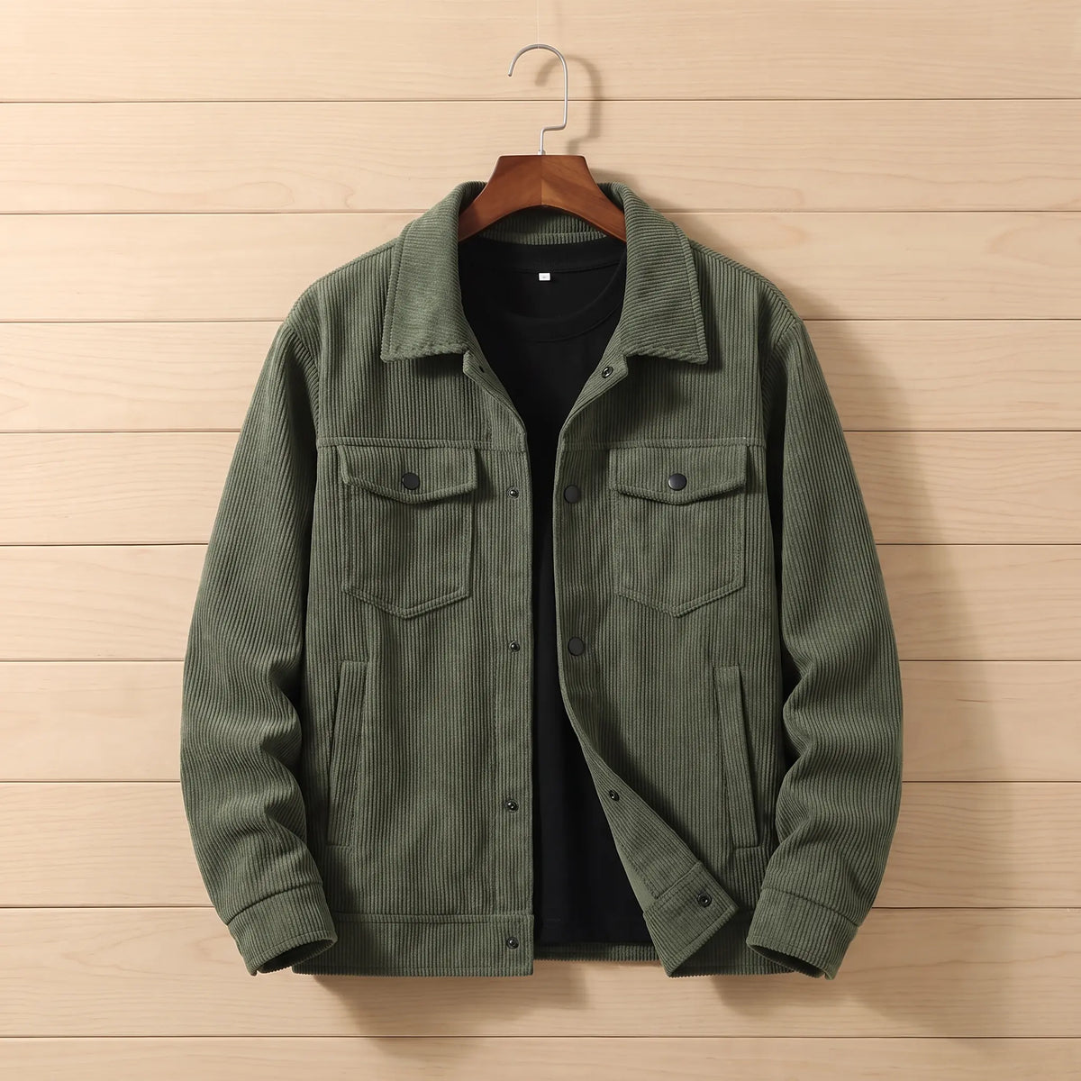 Corduroy chore jacket in green on a hanger