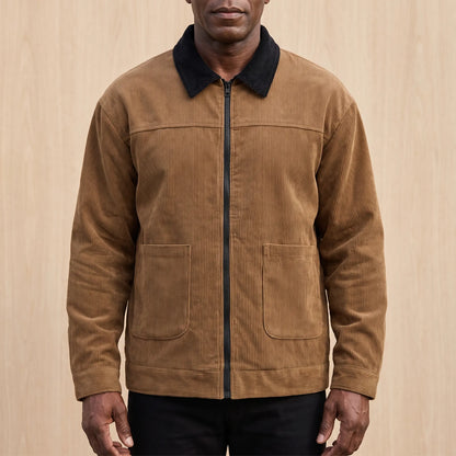 Men's brown corduroy zip jacket with a black corduroy collar and two patch pockets, worn zipped