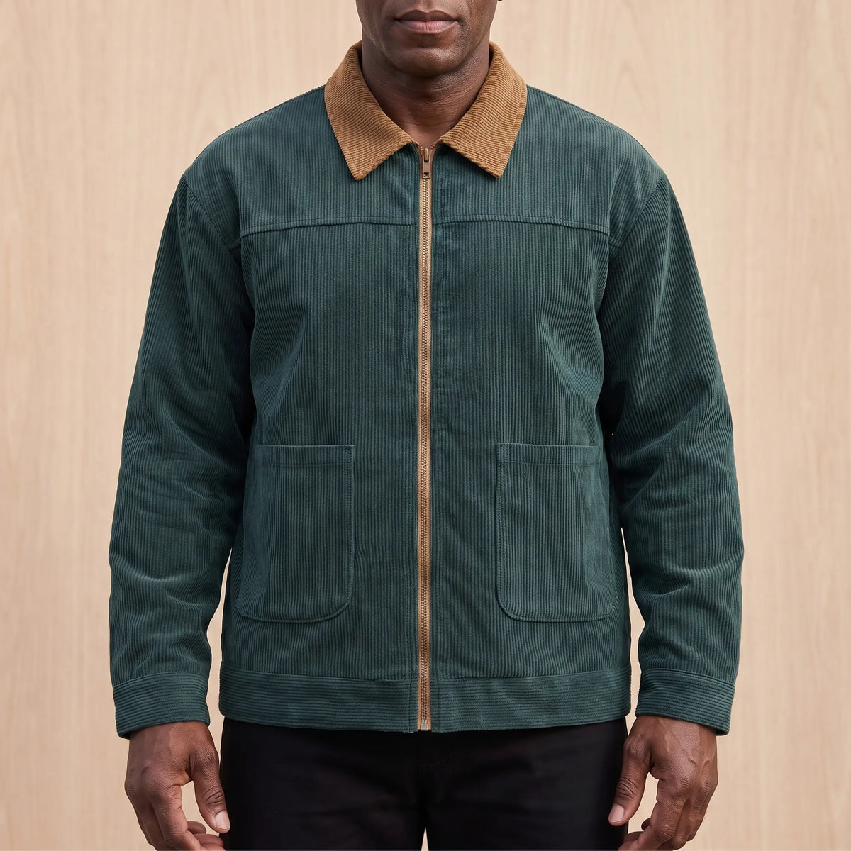 Men's green corduroy zip jacket with a tan corduroy collar and two patch pockets, worn zipped