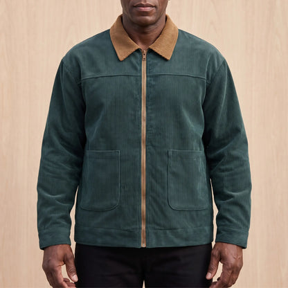 Men's green corduroy zip jacket with a tan corduroy collar and two patch pockets, worn zipped