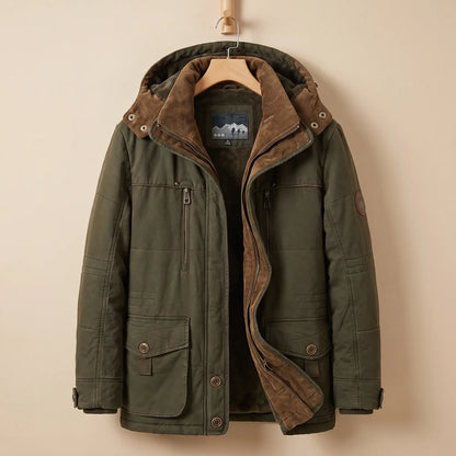 Men's green fleece-lined hooded parka with corduroy collar, zip chest pocket and snap flap pockets on a wooden hanger