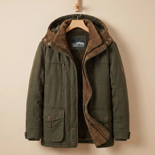 Men's green fleece-lined hooded parka with corduroy collar, zip chest pocket and snap flap pockets on a wooden hanger