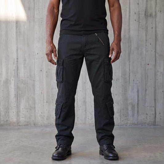 Black cotton twill cargo trousers worn on a model, eight pockets and drawcord hems