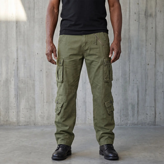 Green cotton twill cargo trousers worn on a model, eight pockets and drawcord hems