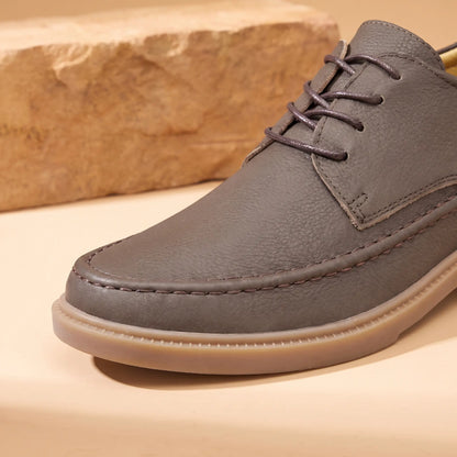 Moc toe stitching and lacing detail