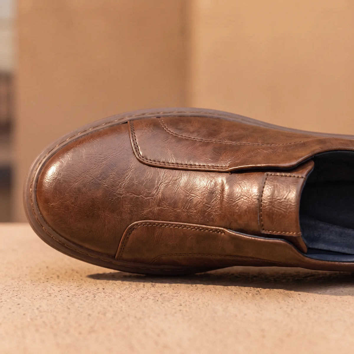 Creased Leather Sneakers in Brown, toe and centre seam close-up