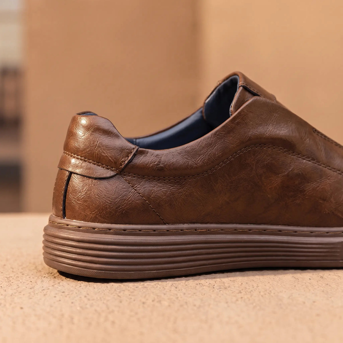 Creased Leather Sneakers in Brown, padded collar and ridged sole close-up