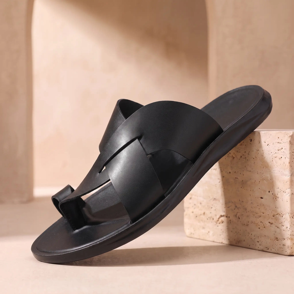Black mens backless slide with crossing bands toe loop and black moulded footbed