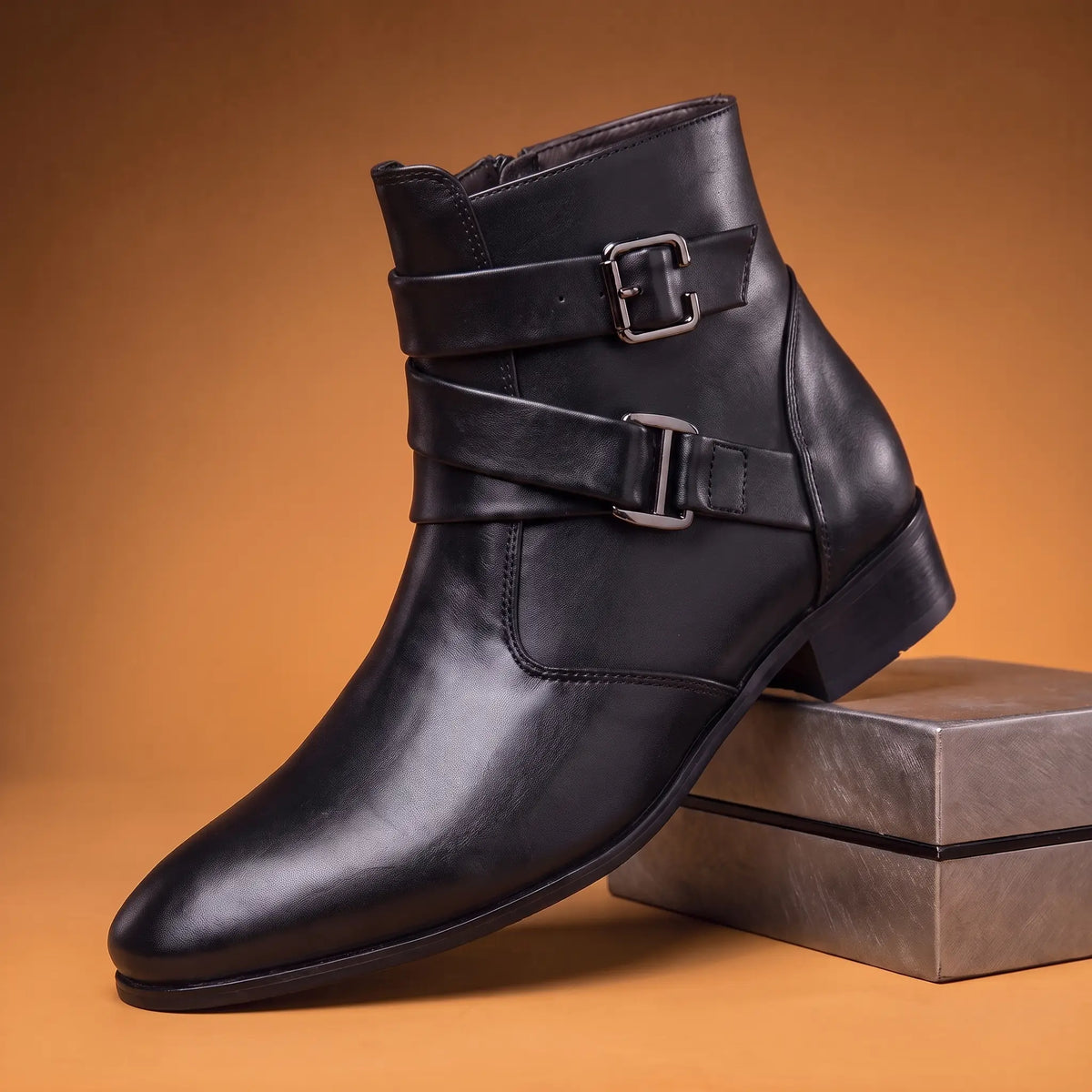 Black mens pointed toe ankle boot with crossed straps twin square buckles and side zip