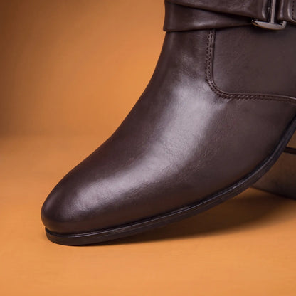 Close up of the pointed toe smooth leather vamp and welt stitch line on a brown mens boot