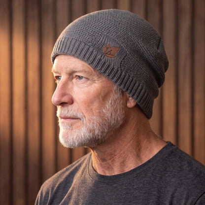 Grey cuffed knit beanie for men worn with a turn-up cuff over the ears