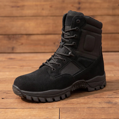 DESERT TACTICAL BOOTS in black, tall lace-up work boot with side zip and lugged sole on a wood floor