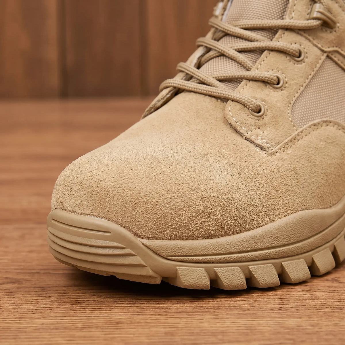 Close up of the DESERT TACTICAL BOOTS toe cap, rubber toe bumper and lugged sole edge