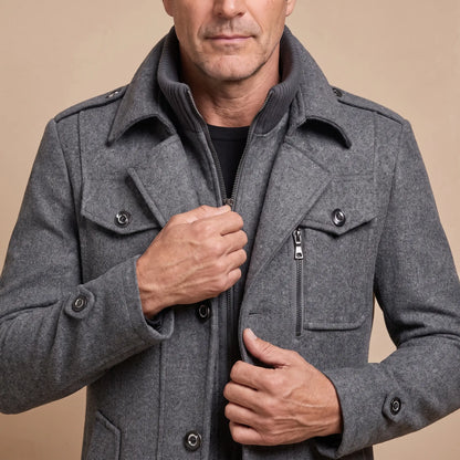 Man drawing up the inner zip of the DOUBLE COLLAR COAT at chest height