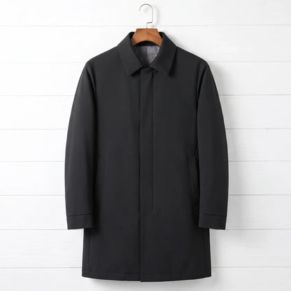Black down lined coat for men, mid-thigh car coat with hidden buttons on a wooden hanger