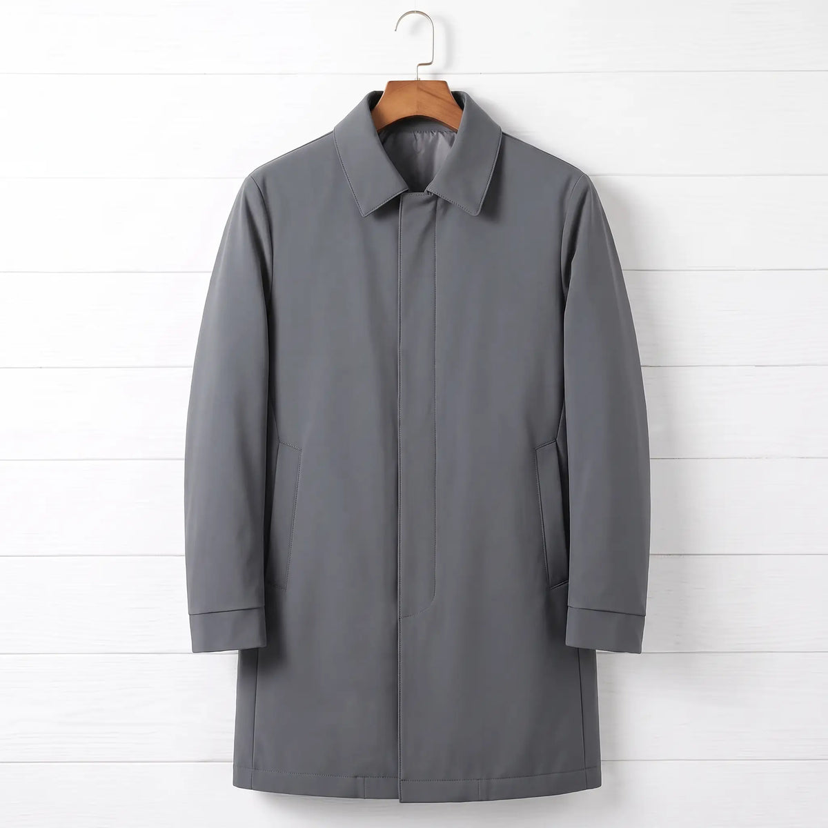 Grey down lined coat for men, mid-thigh car coat with hidden buttons on a wooden hanger