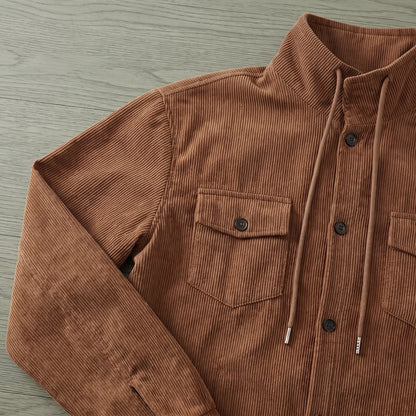Close up of the drawcord collar and buttoned chest pocket on the brown drawcord collar jacket
