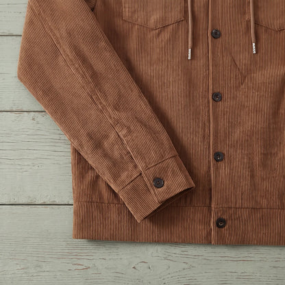 Close up of the corduroy cuff and hem band on the brown drawcord collar jacket