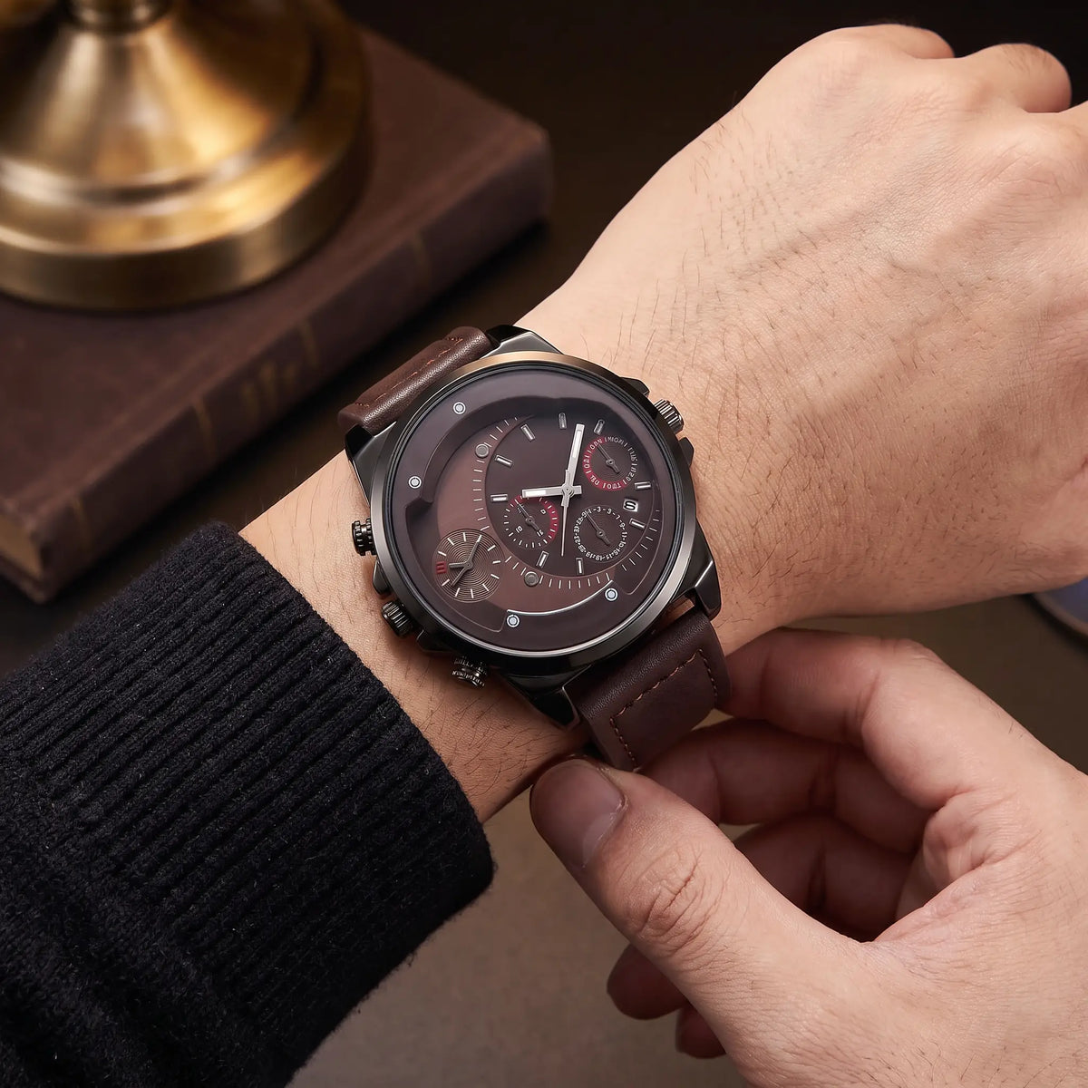 Dual Time Watch in Brown being fastened on the wrist
