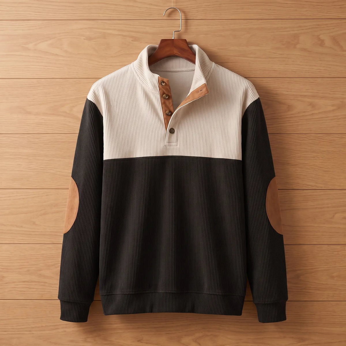 Ribbed knit pullover in black on a wooden hanger
