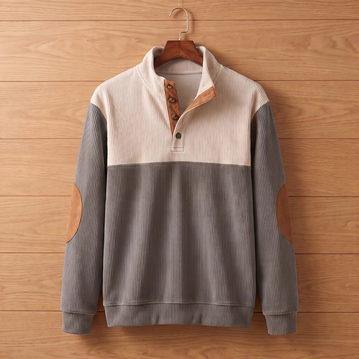 Ribbed knit pullover in grey on a wooden hanger