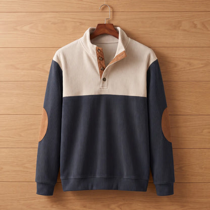 Ribbed knit pullover in navy blue on a wooden hanger