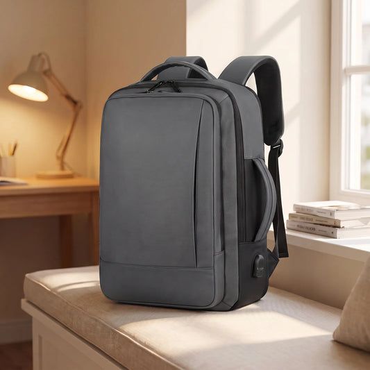 Expandable study backpack in grey on a window seat in a student room