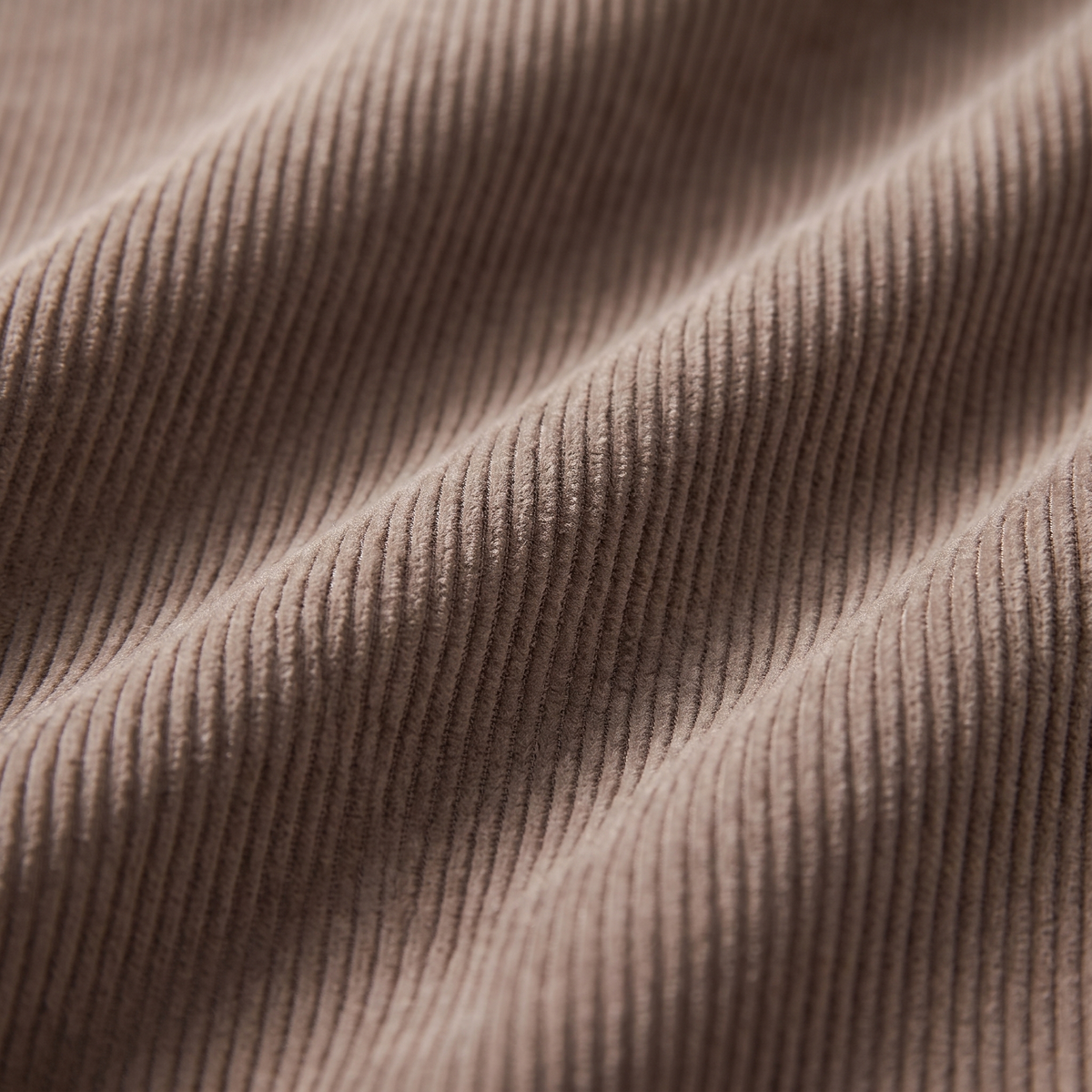 Macro close-up of the fine wale corduroy fabric texture