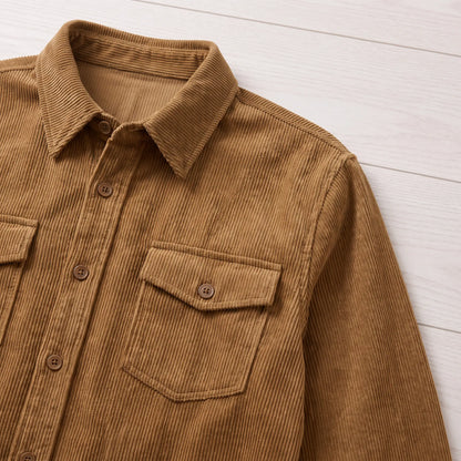 Close-up of the brown Fine Cord Overshirt showing the collar and buttoned flap chest pocket