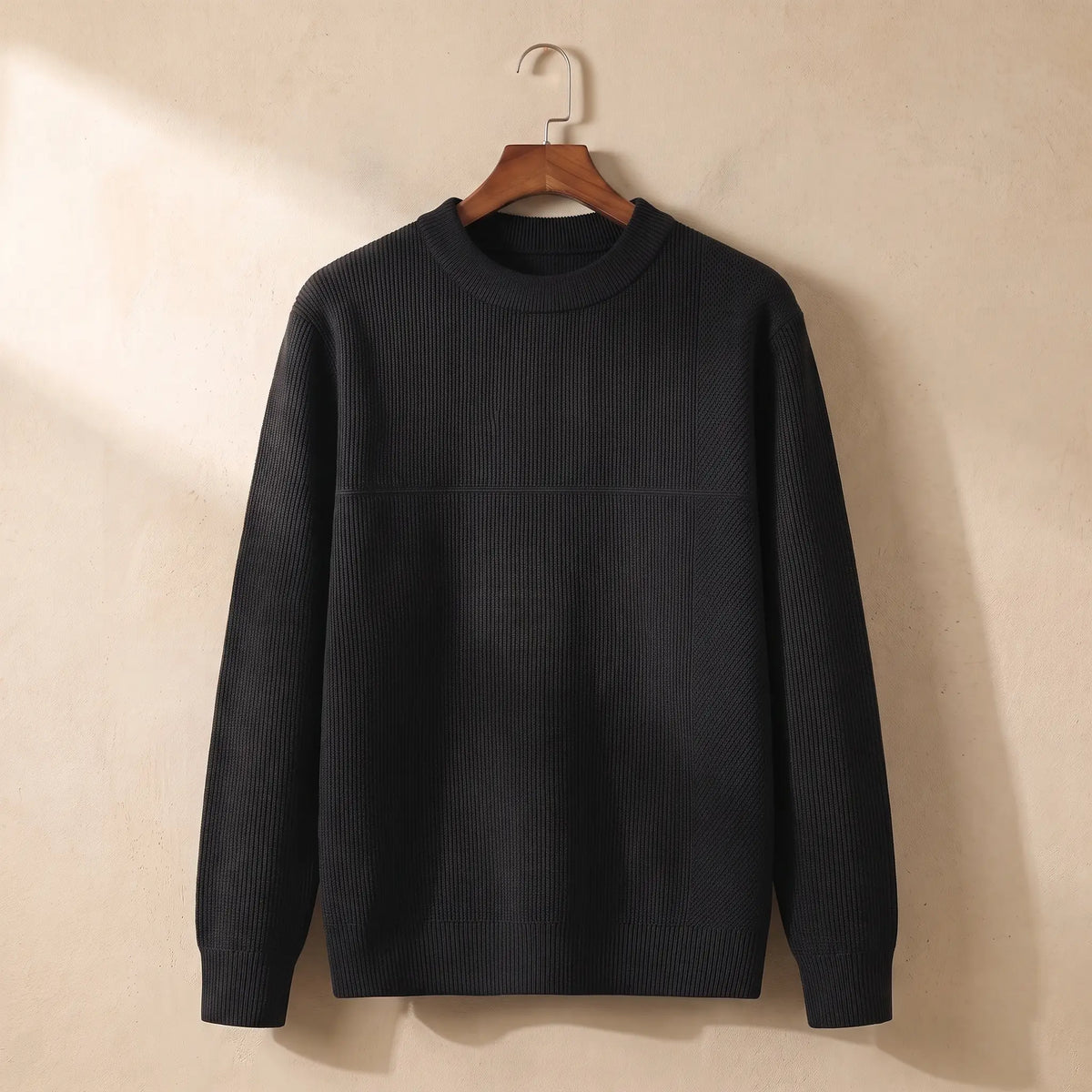 Men's black fine rib crew-neck sweater on a wooden hanger