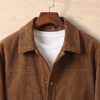 Close up of the turn down collar and button placket on the brown corduroy flap pocket jacket