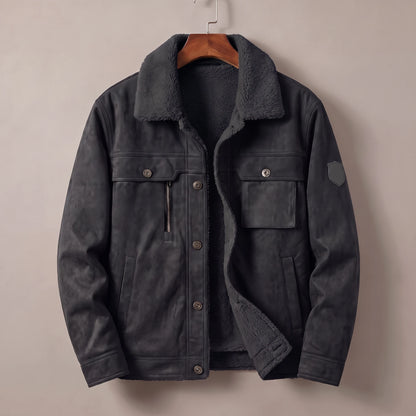 Black fleece lined trucker jacket on a wooden hanger