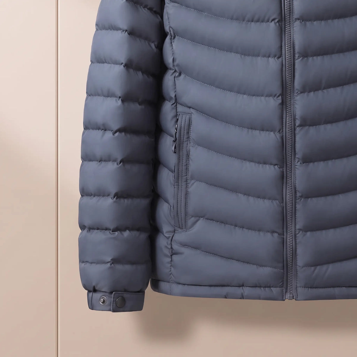 Fleece Hood Puffer in Blue, snap-tab cuff and zip pocket close-up