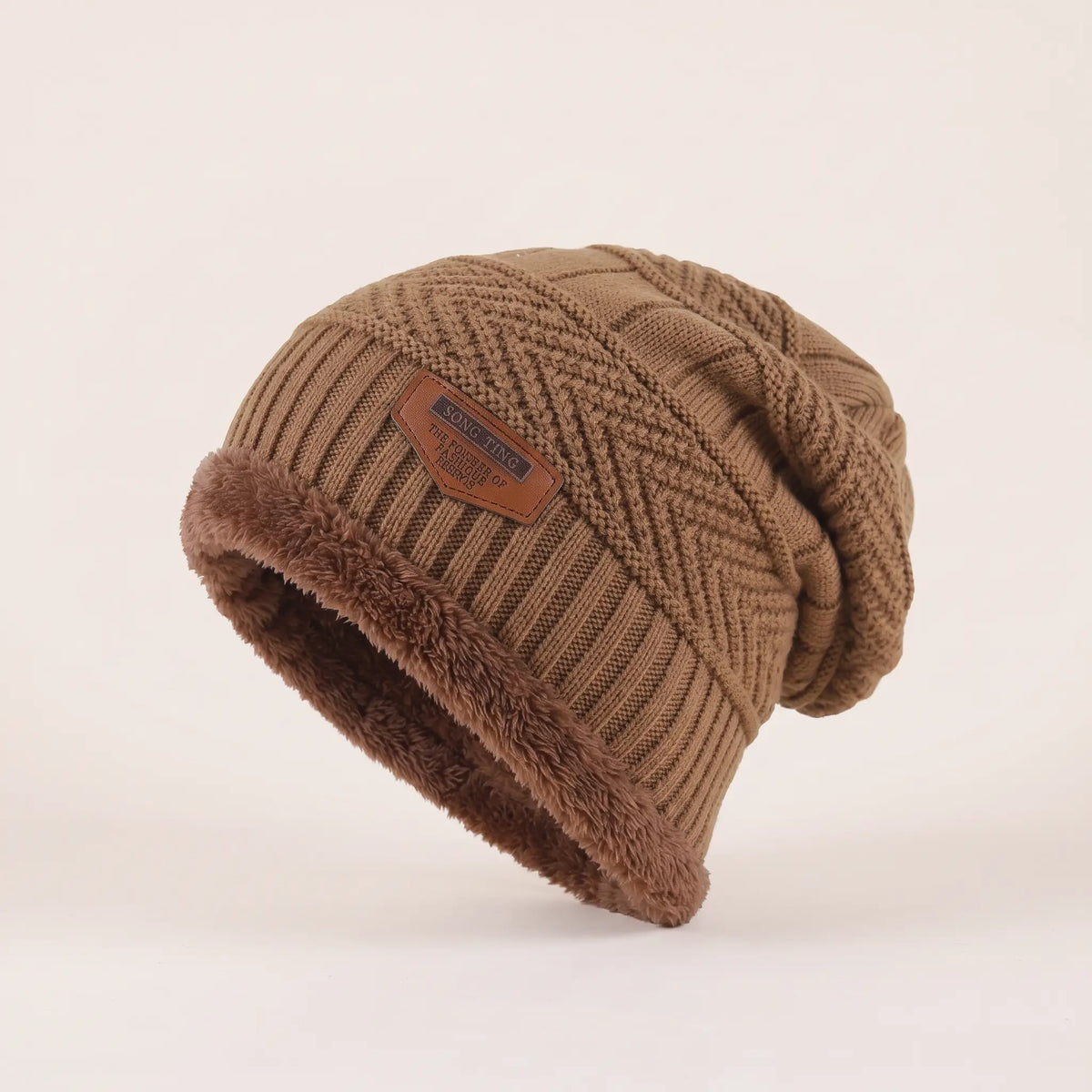 Men's khaki fleece-lined slouch beanie with textured knit, brown fleece cuff and leather patch
