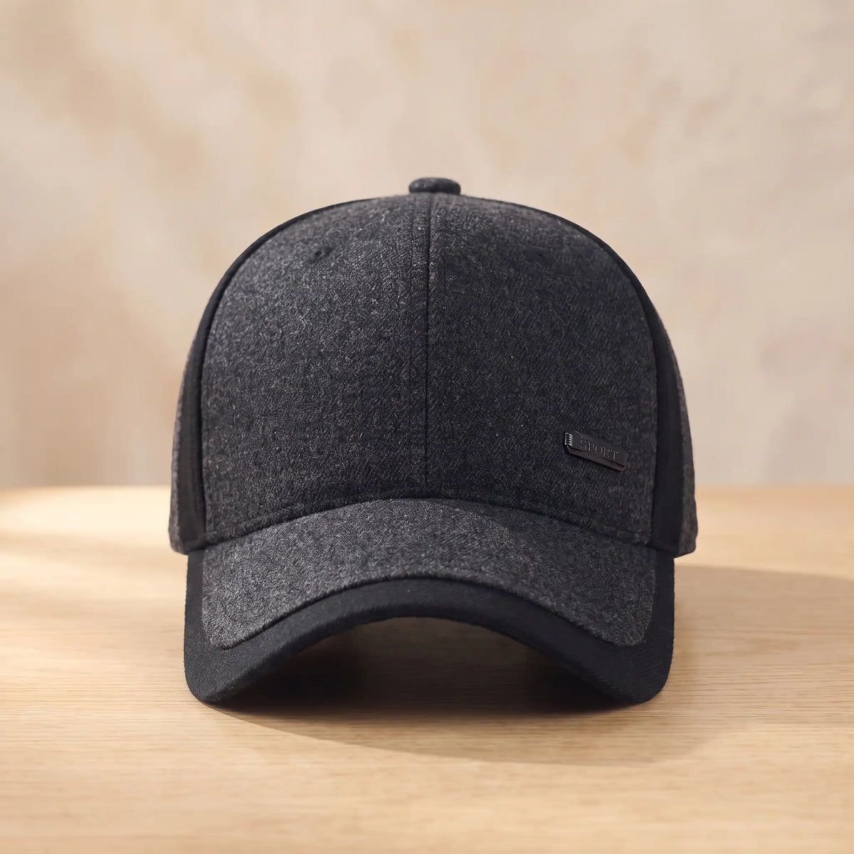 Men's dark grey heather winter baseball cap with black side panel and brim, fold-down ear flaps tucked inside