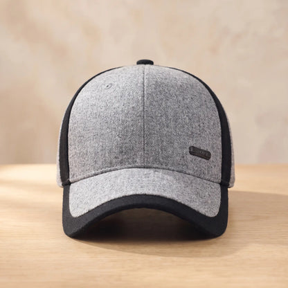 Men's light grey heather winter baseball cap with black side panel and brim, fold-down ear flaps tucked inside
