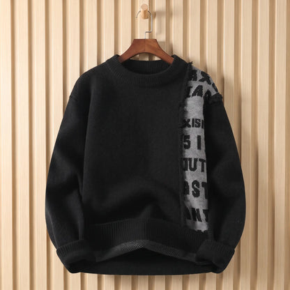 Men's black crew-neck knit sweater with a frayed grey lettered panel down the chest, on a wooden hanger
