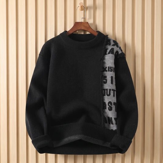 Men's black crew-neck knit sweater with a frayed grey lettered panel down the chest, on a wooden hanger